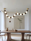 Lustre boule en bois massif à longues bandes de style médiéval